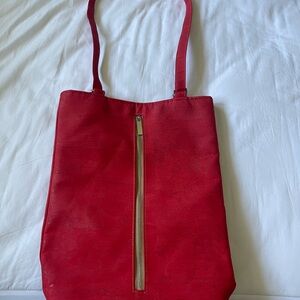 Red cork purse. Can be worn as a shoulder bag or backpack.